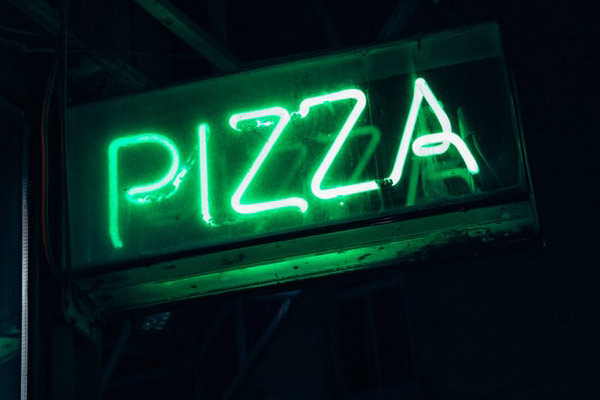 the neon sign of pizza